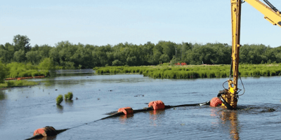 A pipe dredging apparatus in a Louisiana wetlands area powered by U.S. Aqua 