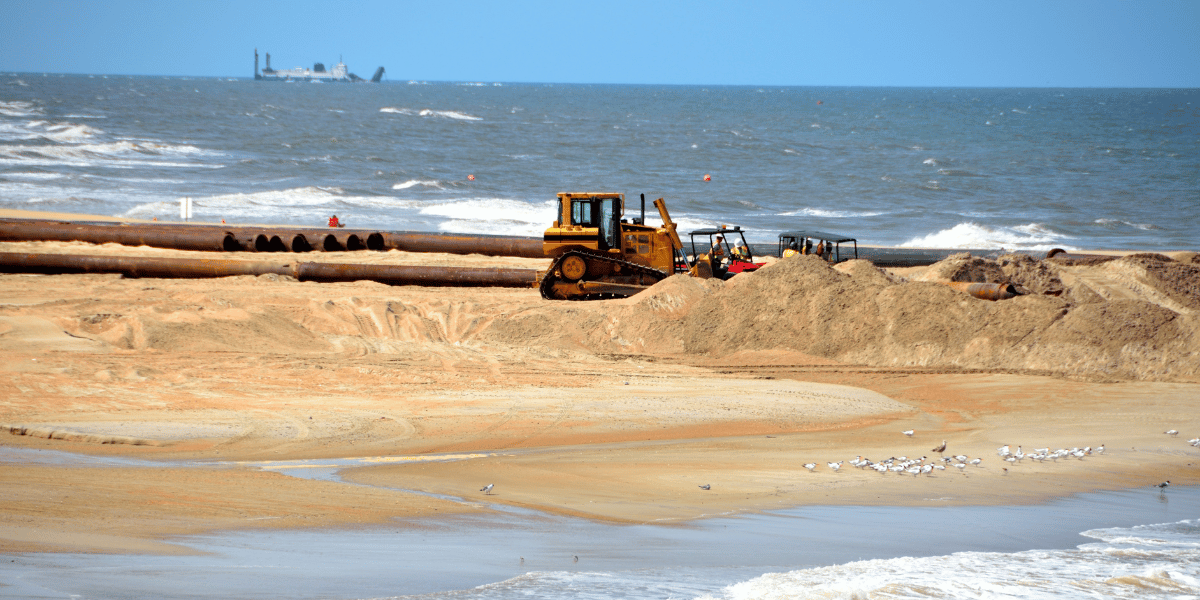 US Aqua's dredging equipment on coast representing their Oilfield Support Services